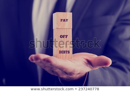 Stock photo: Businessman Paying Off His Debts And Loans