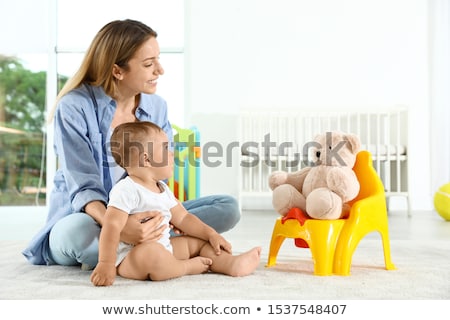 Stok fotoğraf: Female Toddler Sitting On A Potty Pot