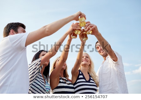 Сток-фото: Happy Friends Drinking Non Alcoholic Beer On Beach