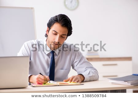 Stok fotoğraf: Young Handsome Financial Speciaist In Front Of White Board