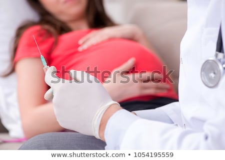 Stock foto: Pregnant Woman Visiting Doctor For Regular Check Up