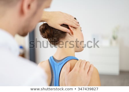 Foto stock: Physical Therapist Working On Head And Shoulders Of Patient