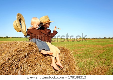 Foto d'archivio: Little Boy Wearing A Cowboy Hat