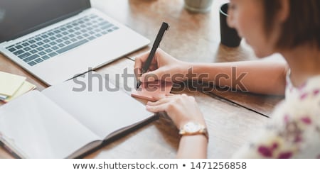 Сток-фото: Businesswoman Writing In Her Agenda