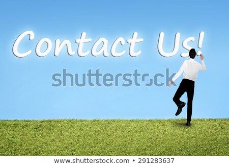 Stockfoto: Man Writing On Sky Contact Us Word