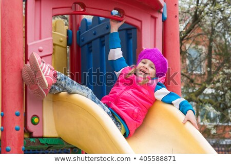 [[stock_photo]]: Girl On Childrens Slide