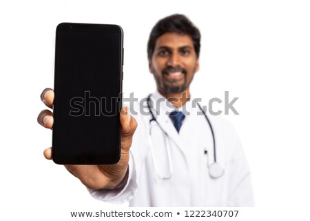 Foto stock: Vertical Image Of Smiling Man Holding Smartphone