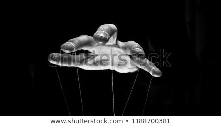 Stock photo: Persons Hand Controlling Puppet