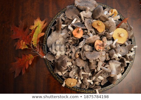 ストックフォト: Fresh Mushrooms In Red Tray On Wooden Background