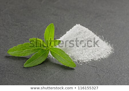 Stockfoto: Stevia Leaves With Stevia Powder On A Slate Plate