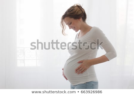 Stock foto: Pregnant Woman Embracing Motherhood