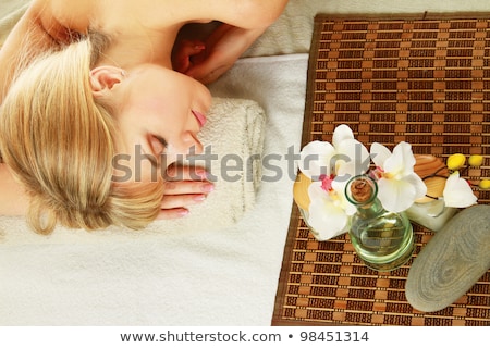 Stok fotoğraf: Beautiful Young Woman With Orchid Flower Isolated On White Backg