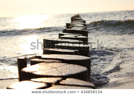 Foto stock: Wooden Pole At The Beach