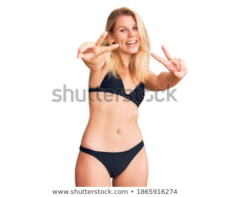 Foto stock: Happy Woman In Swimsuit Showing Victory Hand Sign