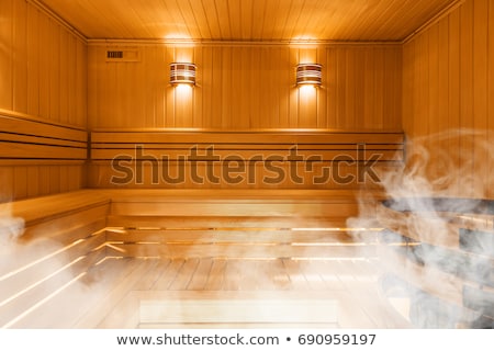Foto stock: Traditional Wooden Sauna For Relaxation With Bucket Of Water