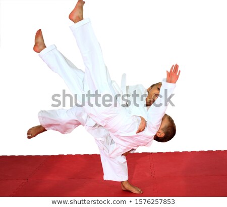 Stockfoto: Girl And Boy In Judogi Are The Training Throws