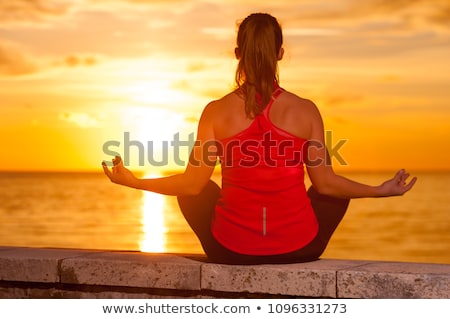 Stok fotoğraf: Yoga Girl Meditating And Relaxing In Yoga Pose Ocean View