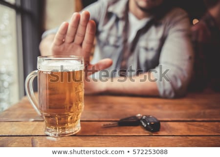 Foto stock: Man Drinking Beer And Driving Car