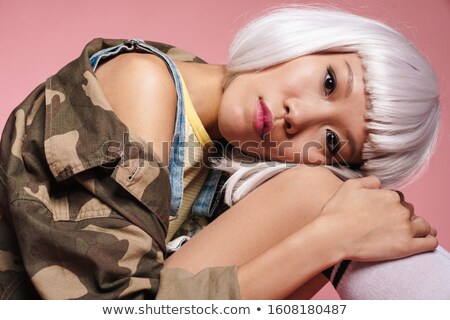 Foto stock: Image Of Young Asian Girl Wearing White Wig Sitting And Looking