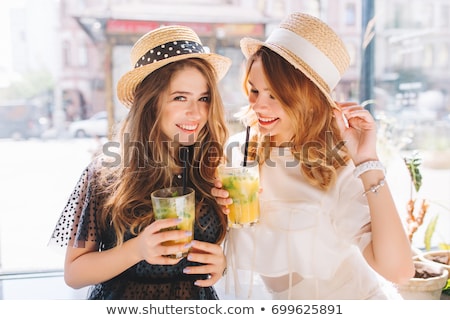 [[stock_photo]]: Smiling Young Woman Wearing A Straw Hat And Having Fun At The Be