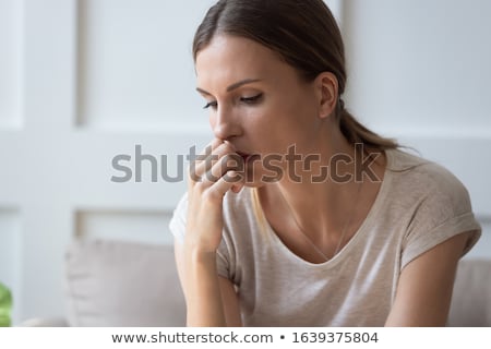 Foto stock: Sad Woman In An Apartment