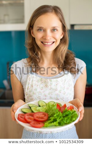 Сток-фото: Attractive Smiling Woman Holding Fresh Lettuce