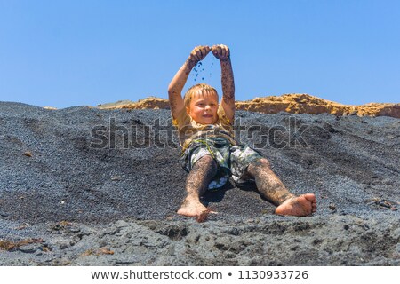 Сток-фото: Boys Have Fun At The Black Volcanic Beach