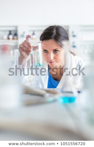 Foto stock: Two Young Female Researchers Carrying Out Experiments In A Lab