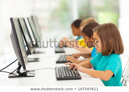 Foto stock: Group Of Male Elementary School Children In Computer Class