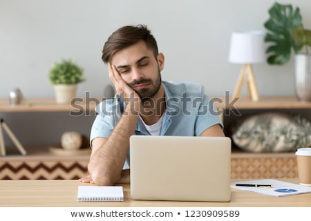 [[stock_photo]]: Overworked Businessman Leaning Head On Desk