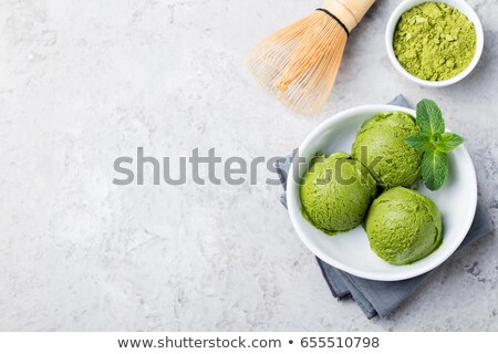 Сток-фото: Green Tea Matcha Ice Cream Scoop In Bowl On A Grey Stone Background Copy Space