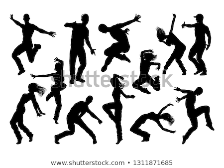 Foto stock: Silhouetted Dancing Young Woman