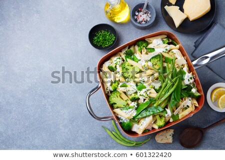 ストックフォト: Pasta With Green Vegetables And Creamy Sauce In Copper Saucepan Top View