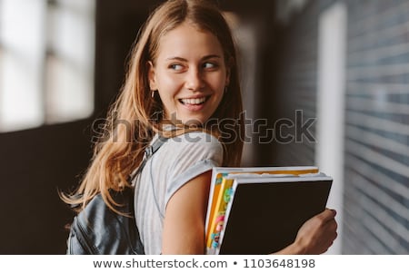 [[stock_photo]]: Ue · arrière · de · l'étudiante · dans · le · couloir · de · l'université