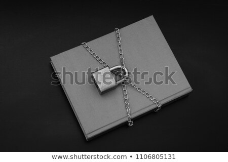 Foto stock: Close Up Of Book With Padlock