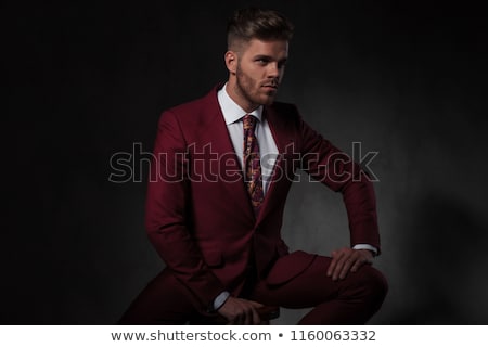 Stok fotoğraf: Portrait Of Relaxed Businessman Looking Seductively While Sittin