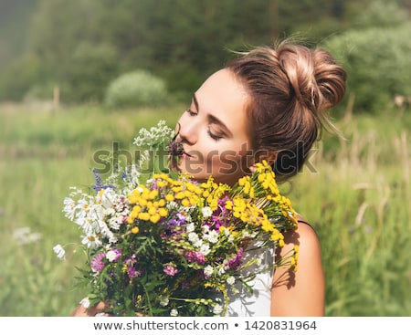 Stok fotoğraf: Natural Beauty Girl With Bouquet Of Flowers Outdoor In Freedom Enjoyment Concept