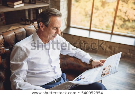 Stock foto: Attention Man Reading A Newspaper