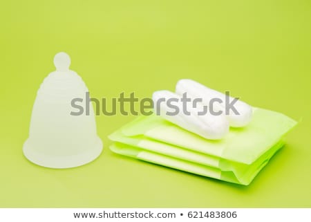 Stock photo: Different Types Of Feminine Hygiene Products - Menstrual Cup And Tampons