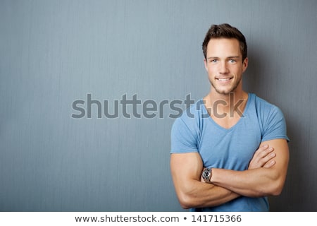 Сток-фото: Portrait Of Smiling Man With Muscular Arms