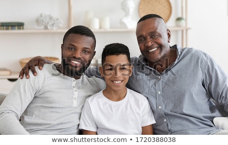 [[stock_photo]]: Grandson Posing With His Grandparents