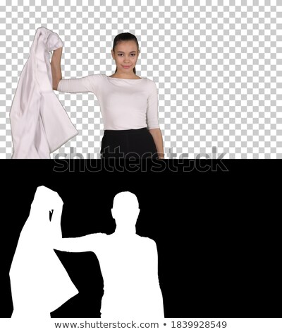 ストックフォト: Attractive Woman Takes Off A Dress