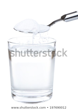 Сток-фото: Spoon Of Baking Soda Over Glass Of Water