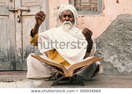 [[stock_photo]]: Old Indian Sadhu Speak Up Sacred Scriptures