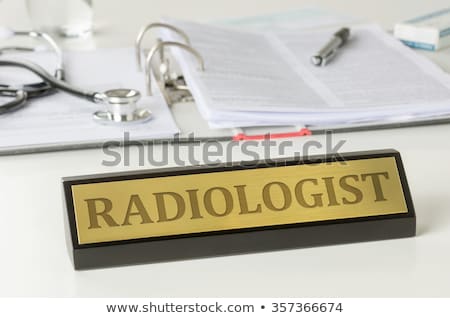 Foto stock: Name Plate On A Desk With The Engraving Radiologist