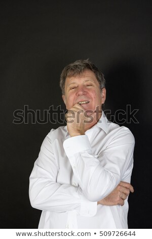 [[stock_photo]]: Mature Man In White Business Shirt Looking Snotty