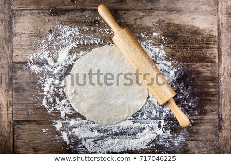 Stockfoto: Closeup Rolling Pin Covered With Dough