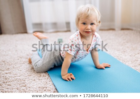 [[stock_photo]]: Pretty Little Baby Girl Sitting On Floor With Plaid