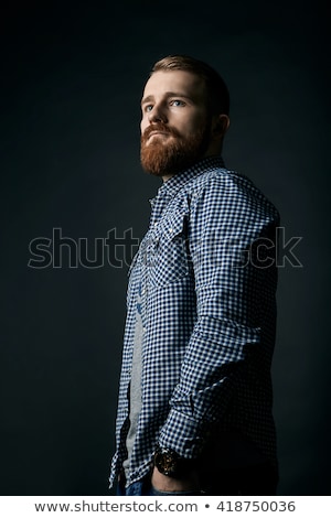 Stockfoto: Thoughtful Red Bearded Man Studio Portrait On Dark Background