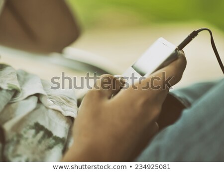 Stock photo: Boy With Mp3 Player Smiling